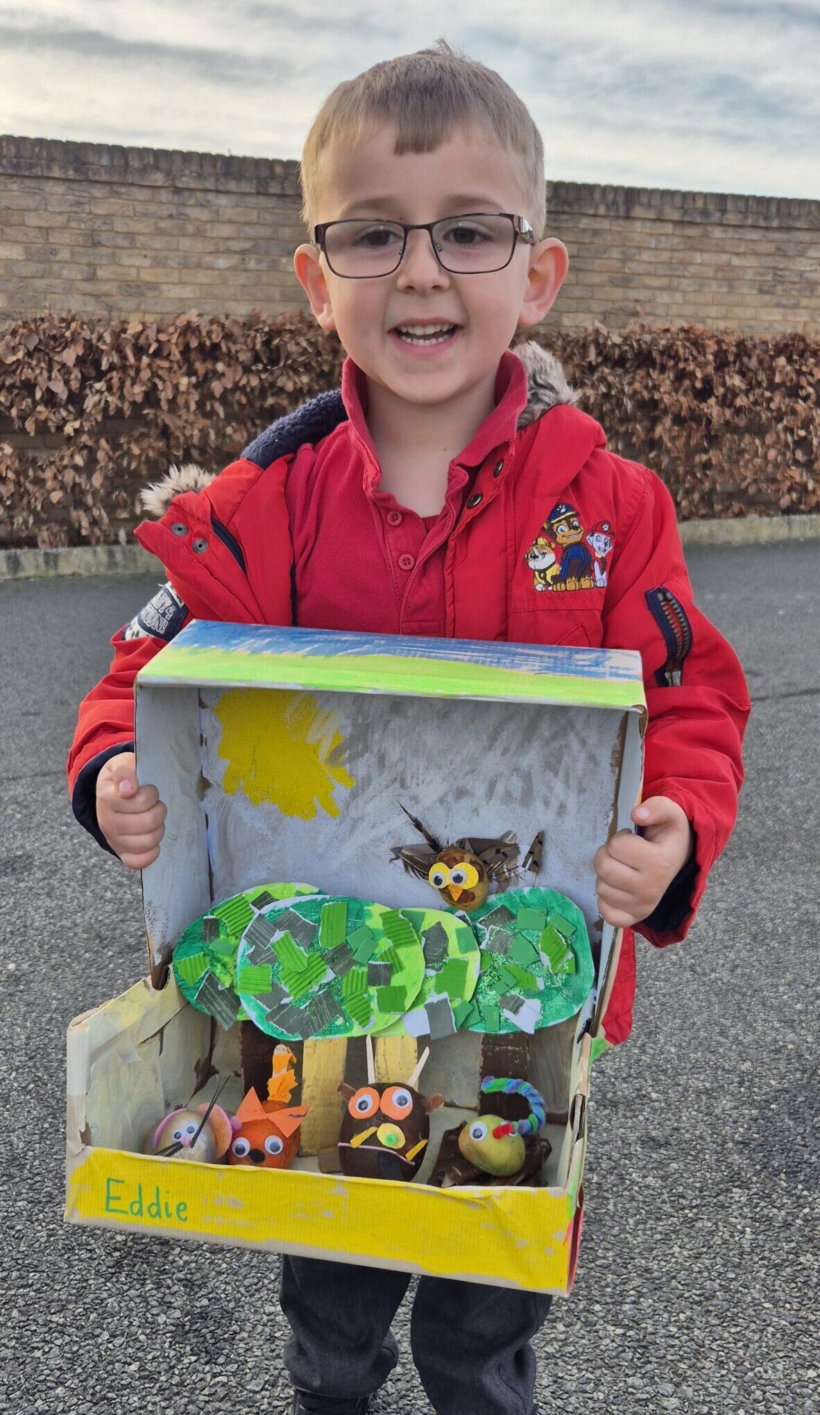 eddie-gruffalo-model-potatoes Eddie holding up a home made set of the Gruffalo created in a shoe box.