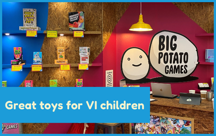 Great toys for VI children. An image of different toys stacked on shelving.