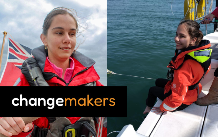 Changemaker Zehra in a red life jacket sailing a boat.