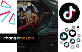 Evelyne in a car with the door open, with a magazine covering her face.