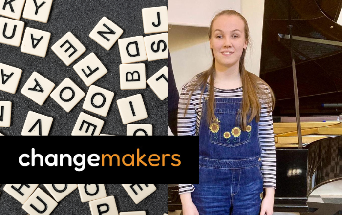 Lydia On the left are scrabble tiles and on the right is Lydia. She has long fair hair, and is wearing a pair of denim dungarees with sunflowers on the front.