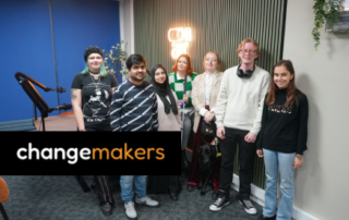 A group of changemakers smiling at the camera.