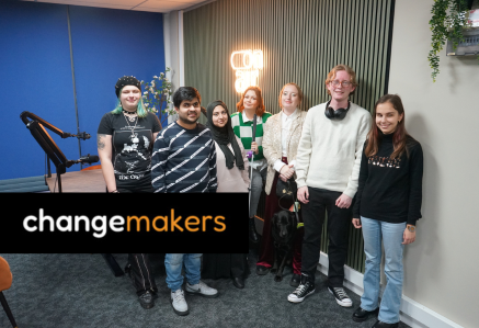 A group of changemakers smiling at the camera.